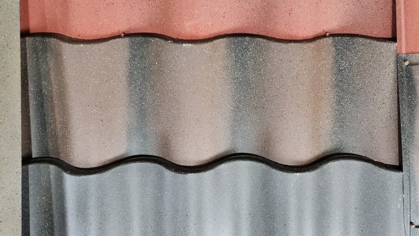Close up of Metal Tile roof panels in various colors