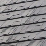 Close up view of the Metal Shingle roof panels in charcoal