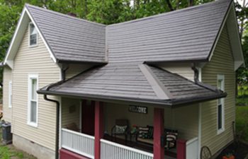 Metal Shingle roof panels on house in weathered wood in Franklin Indiana
