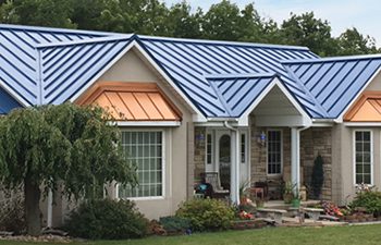 Standing seam roof in custom blue and copper penny colors