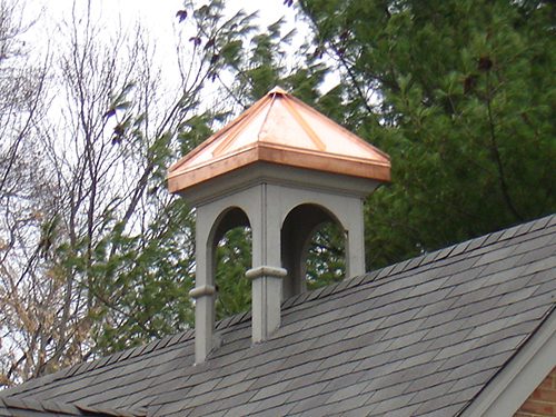 copper chimney cap on home