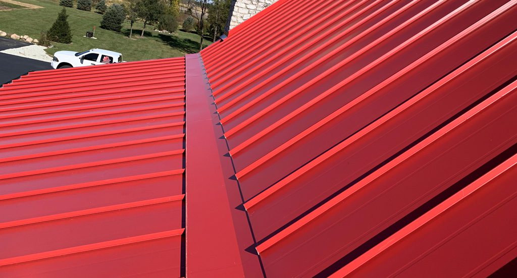 Standing seam roof in Sienna Sunset red on roof