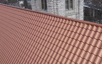 Church roofing with metal tile panels