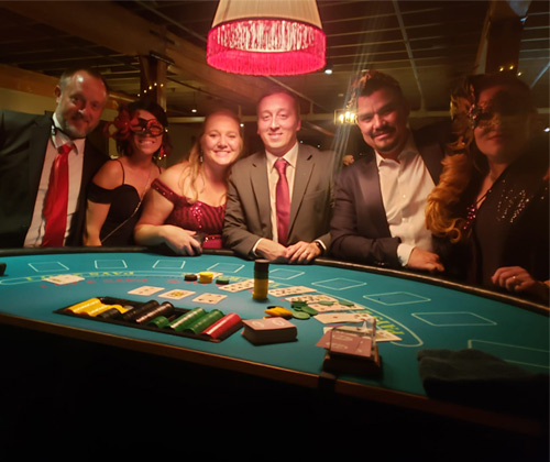 cornett employees standing around a blackjack table